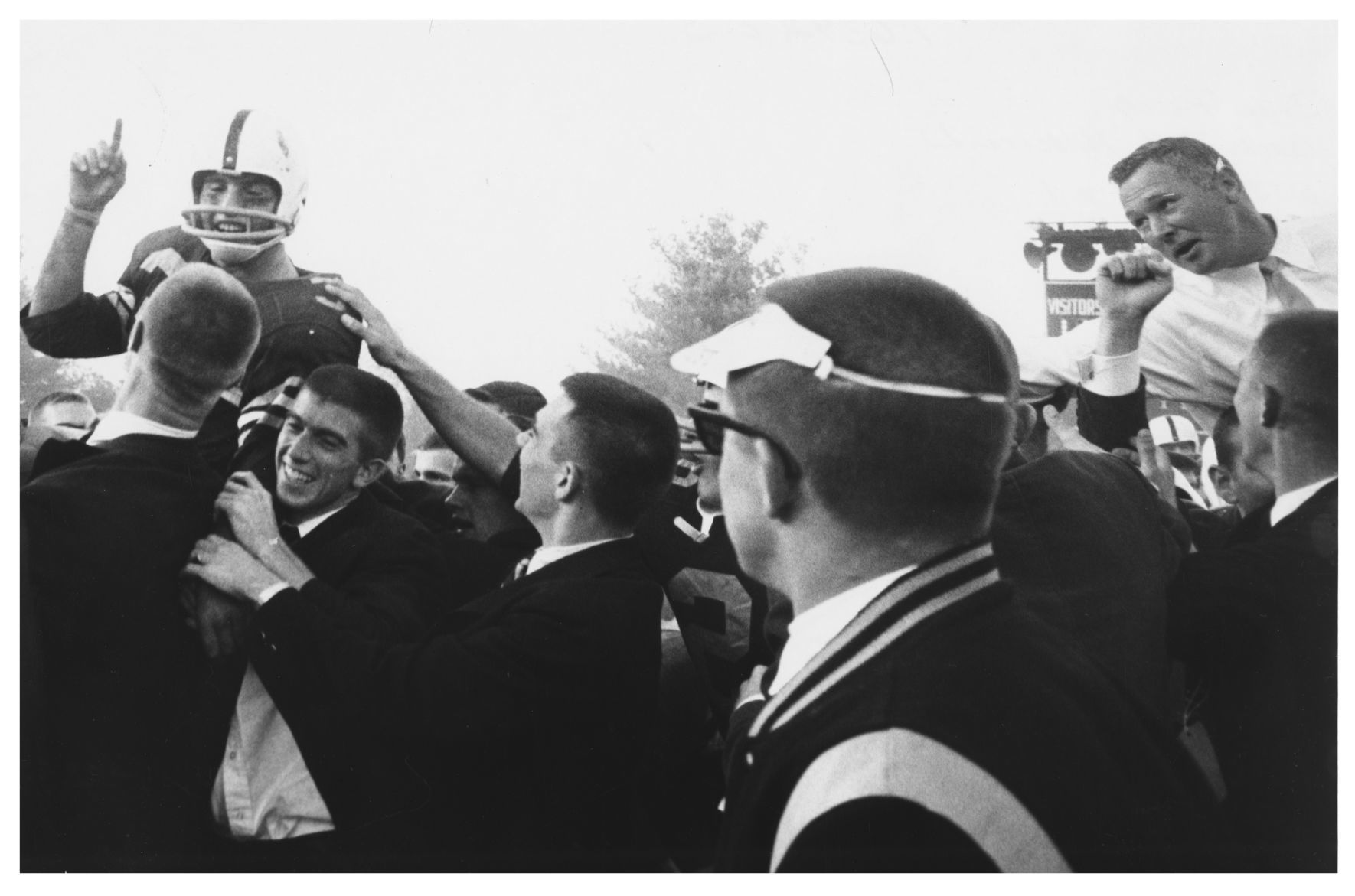 Brian Piccolo carried off the field at Bowman Gray Stadium